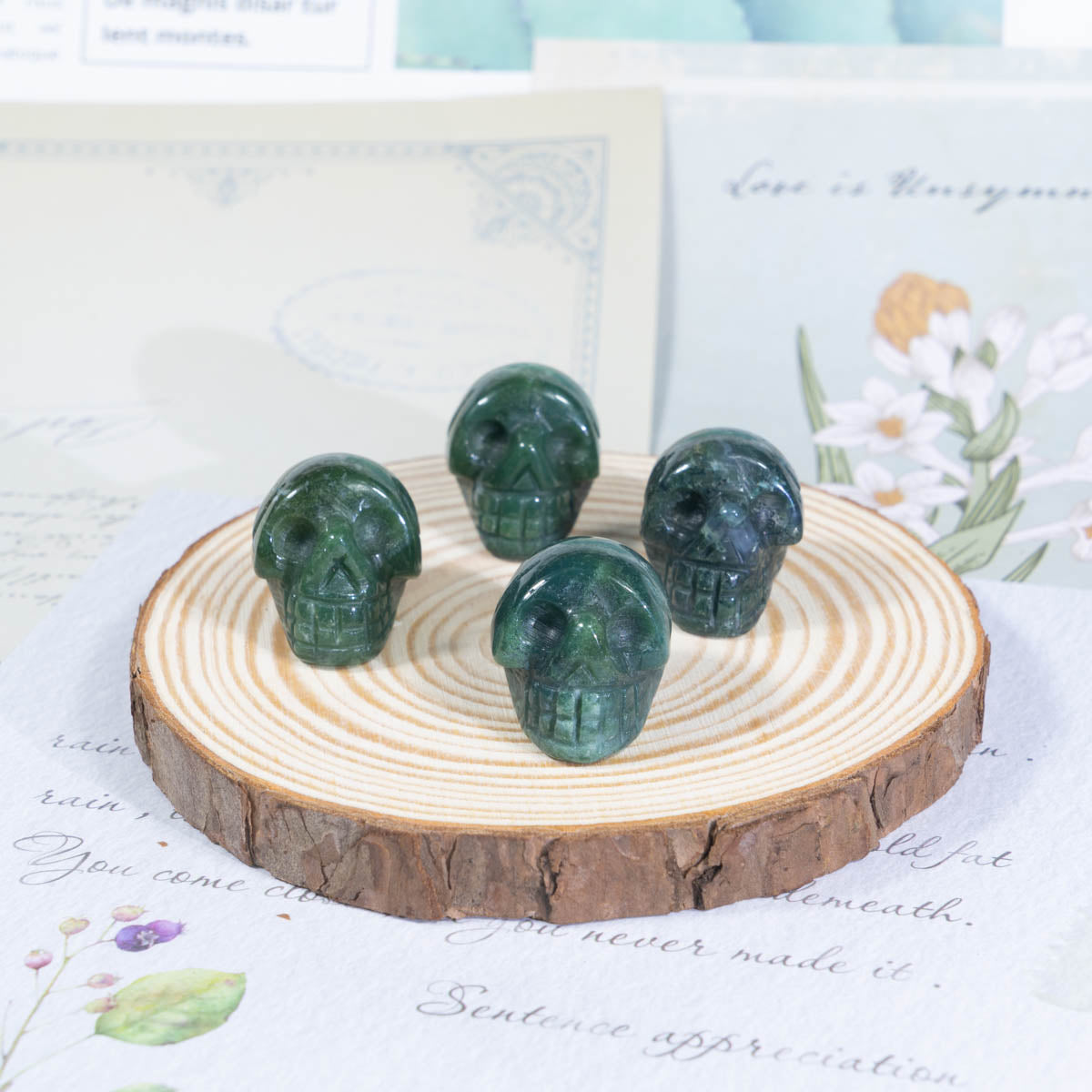 1-Inch Moss Agate Skull In Bulk